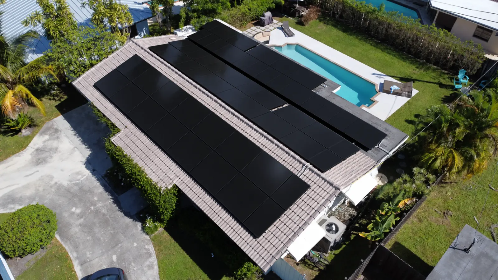 Aerial view of black solar panels on a Florida home